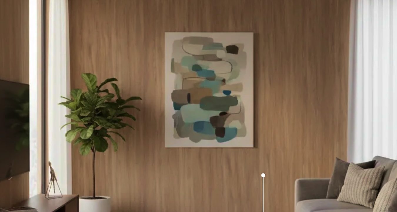 Sala com parede revestida em painel de pedra natural